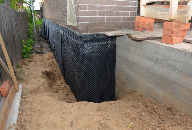 Happy homeowners after waterproofing job in Goodwater